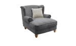 Loveseat-Sessel in der Farbe Grau mit einem beigefarbenen Kissen