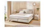 Boxspringbett Kaprun Mix, mit einem Chenillebezug in der Farbe Beige, in einem Raum stehend