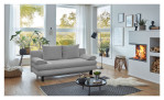Schlafsofa Bill in Silber aus einem Breitcordbezug und schwarzen Füßen. Auf einem dekorierten Hintergrund.