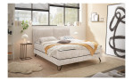 Boxspringbett set one Baldwin in der Farbe beige, in einem Raum stehend